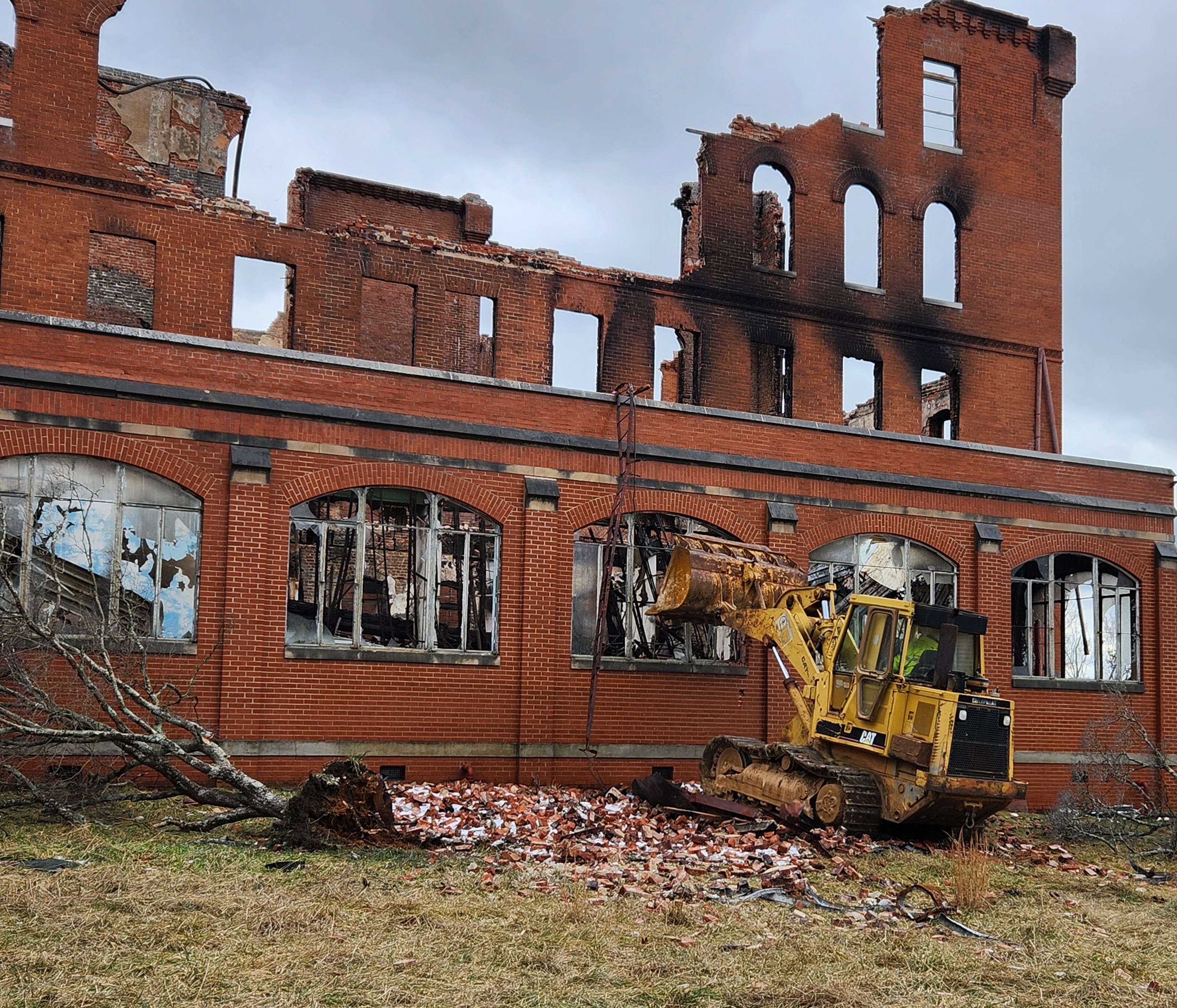 Demolition crews work on tearing down the walls of the buildings still standing after a Dec. 20 fire at the former Virginia Intermont campus in Bristol.