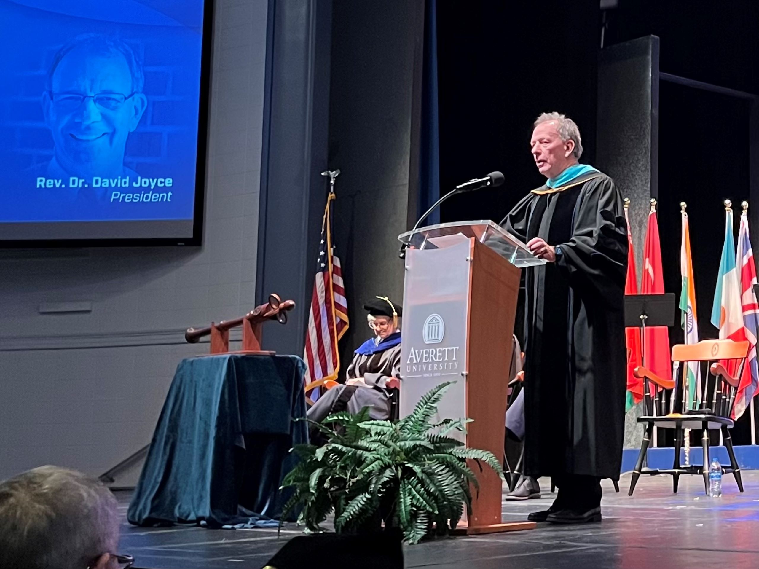 A man, Averett University president David Joyce, speaks to a crowd of faculty and students during the university's Founders Day celebration.