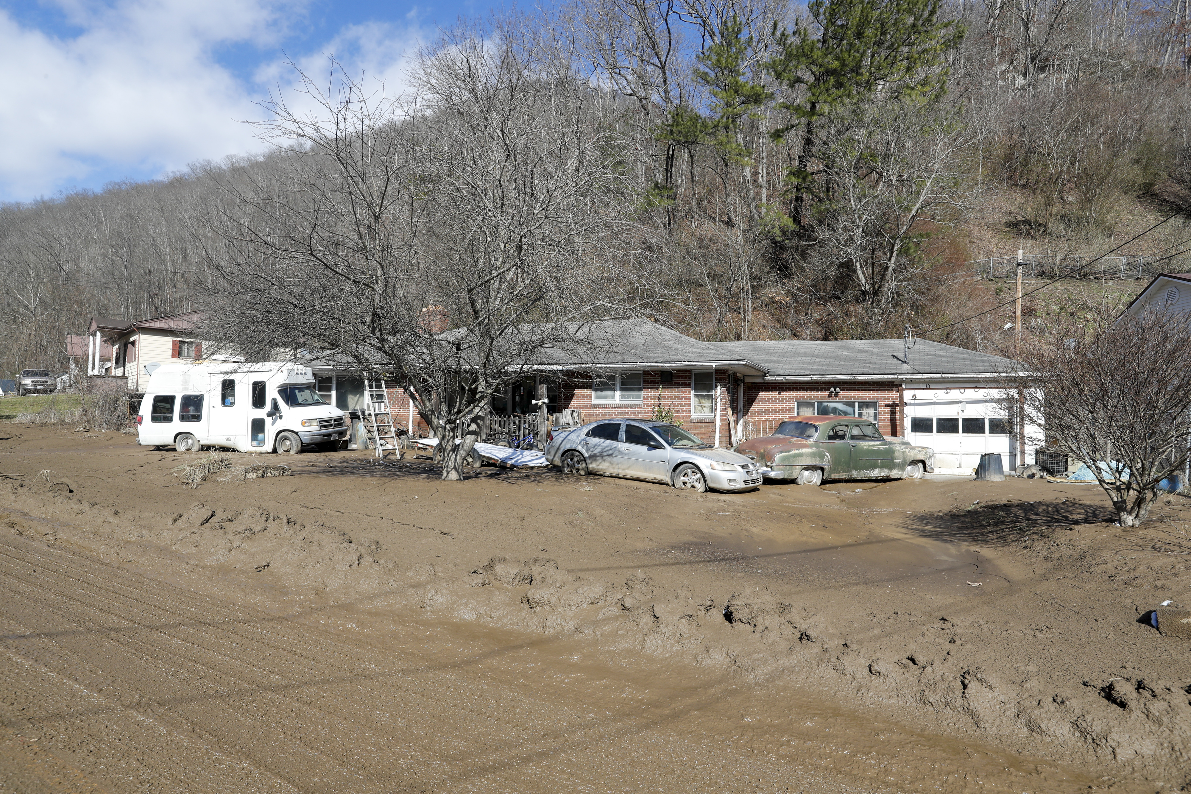 A home in Hurley is surrounded by mud after floodwaters ripped through the community over the weekend. Photo by Ben Earp/Ben Earp Photography.