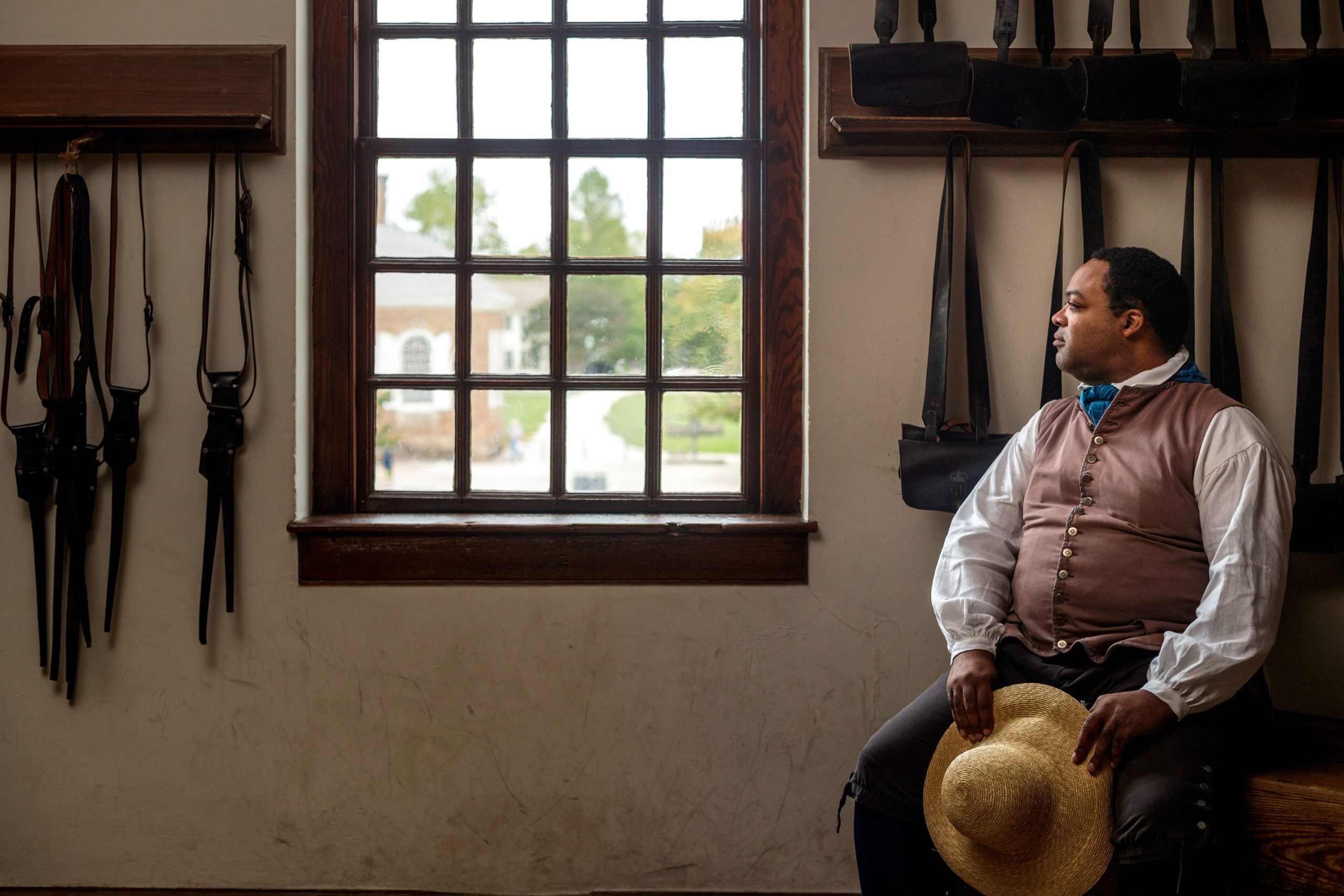 Interpreter Stephen Seals, portraying Nation Builder James Armistead Lafayette, poses by a window in the Magazine. Courtesy of Colonial Williamsburg Foundation.