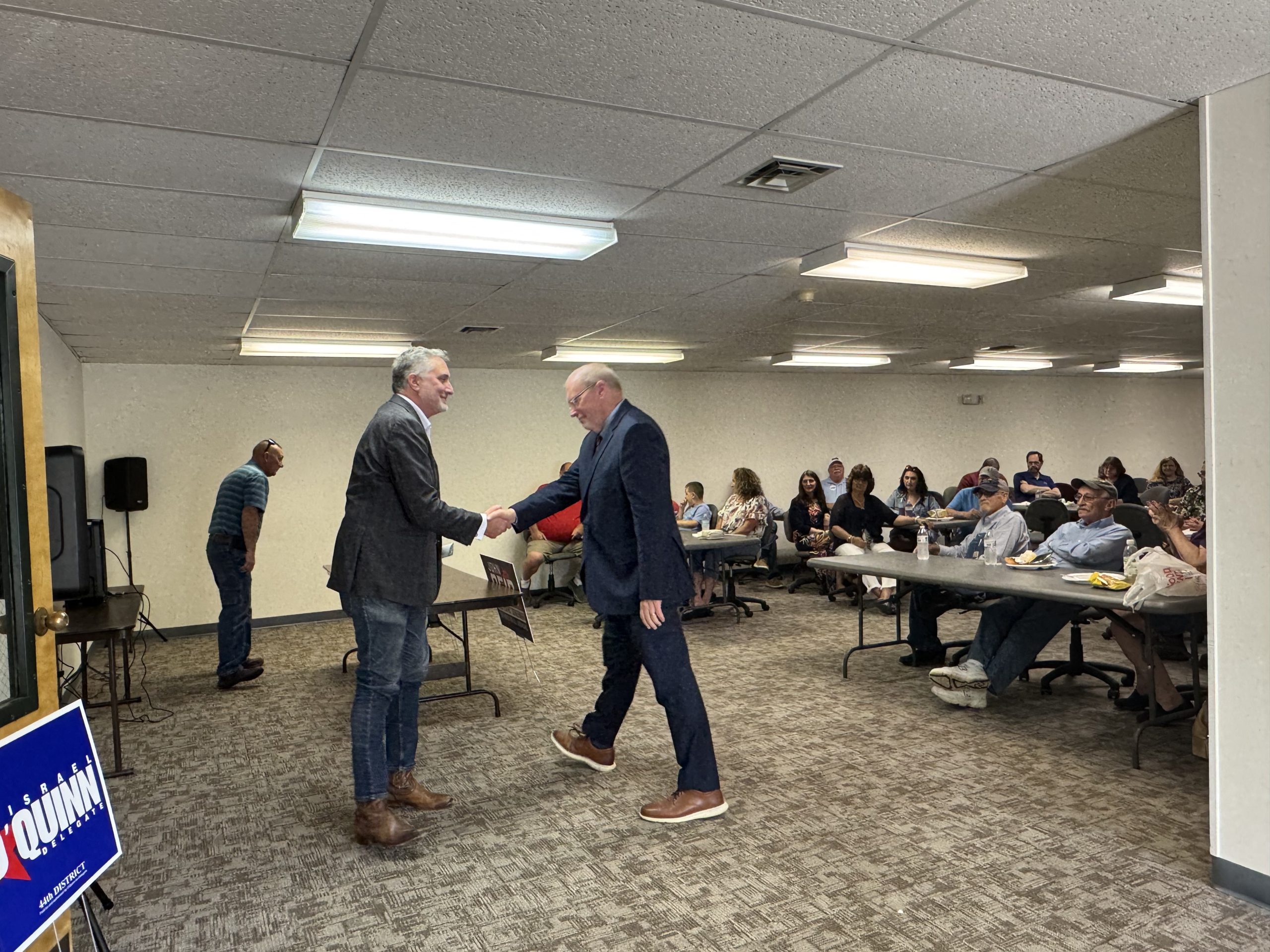 John Reid, left, greets Rep. Morgan Griffith at the Republican event in Abingdon. Photo by Senta Scarborough.