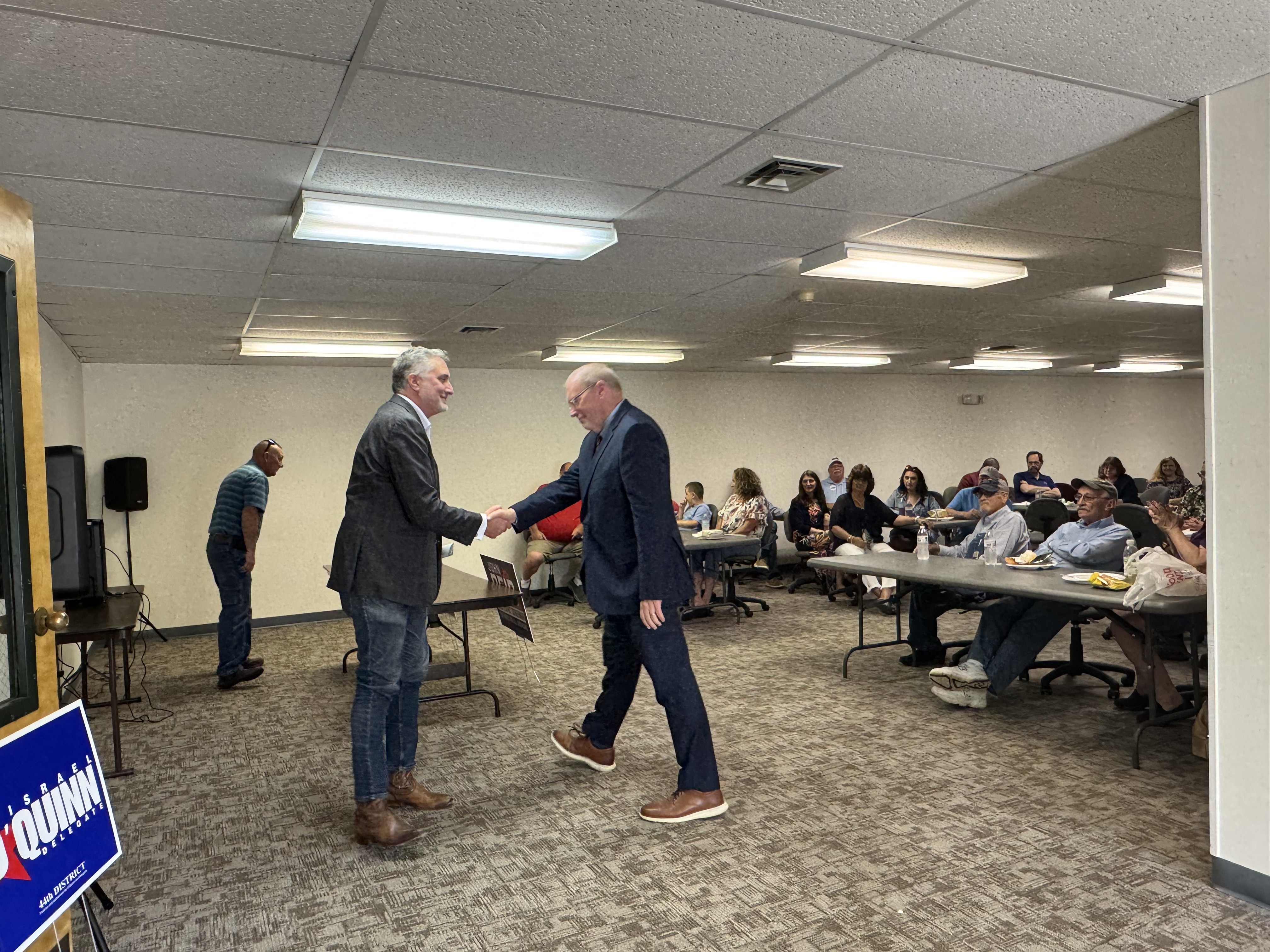 John Reid, left, greets Rep. Morgan Griffith at the Republican event in Abingdon. Photo by Senta Scarborough.