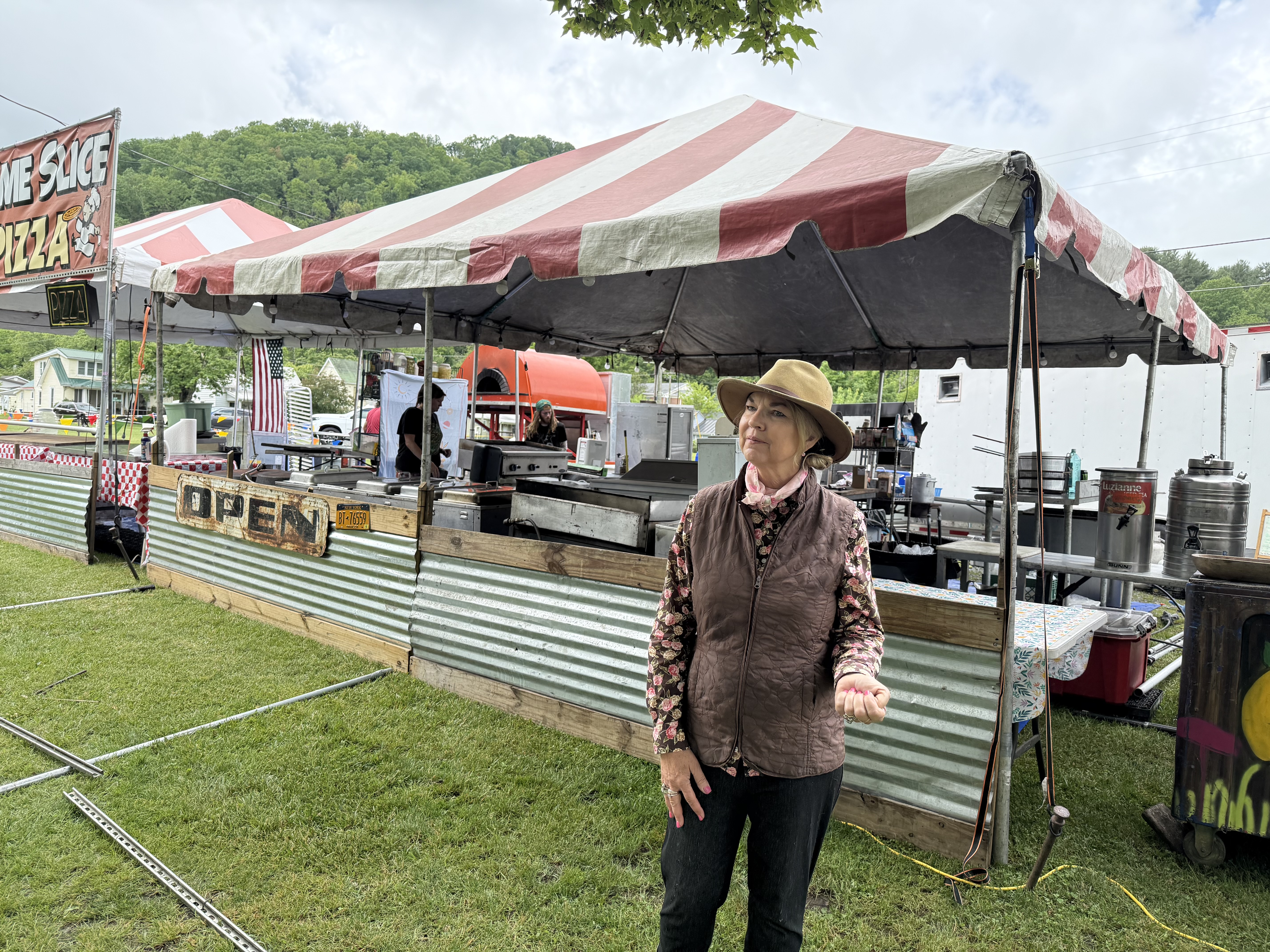 Peggy Welborn helps set up a food booth at Trail Days for her daughter's restaurant business Outback Kate's of Mountain City, Tennessee. Photo by Carolyn Wilson.