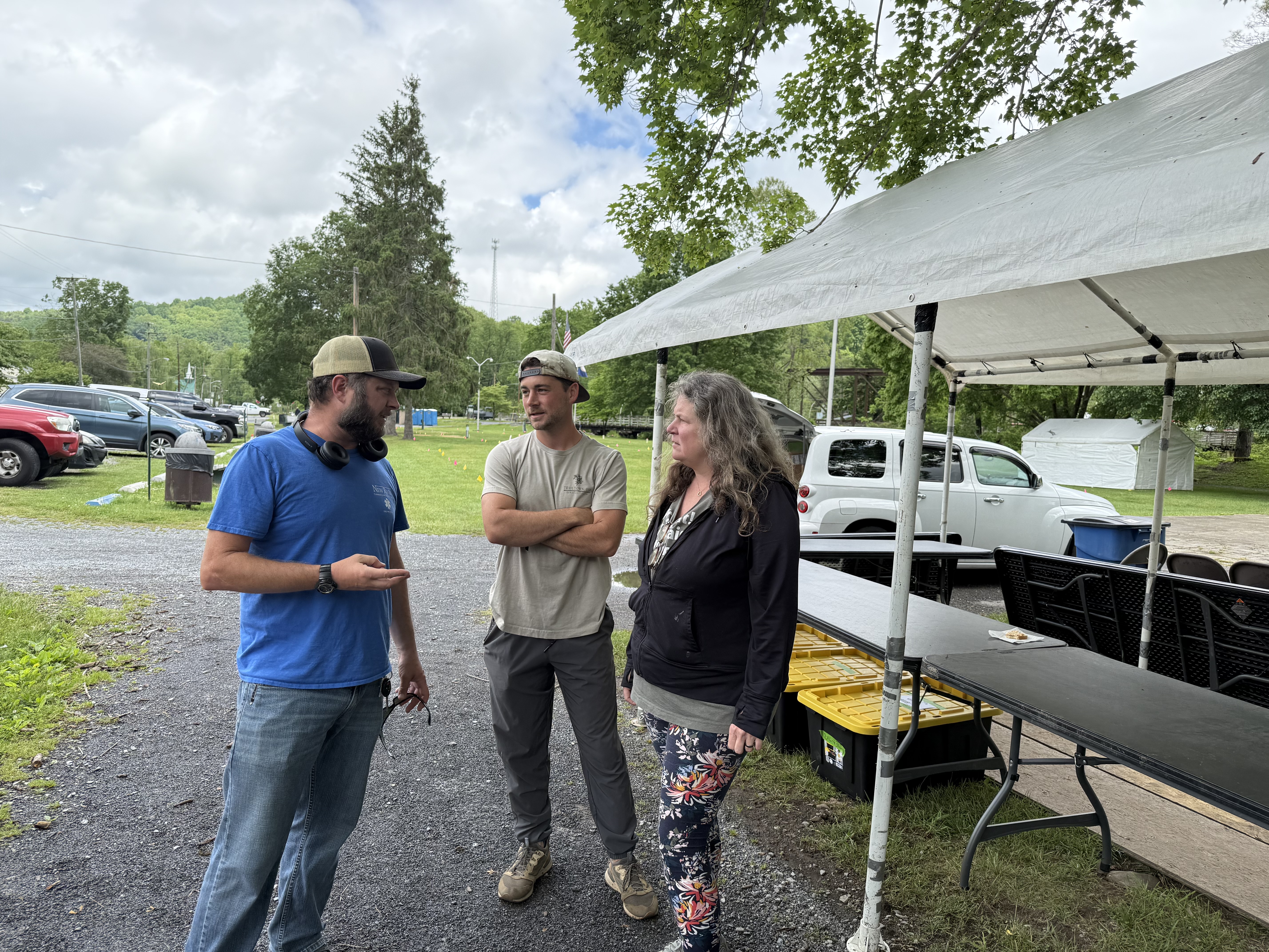  From left, Joshua Roe, a volunteer from Radford University, talks to mayor and vice mayor Hunter Faust and Katie Lamb. Photo by Carolyn Wilson.