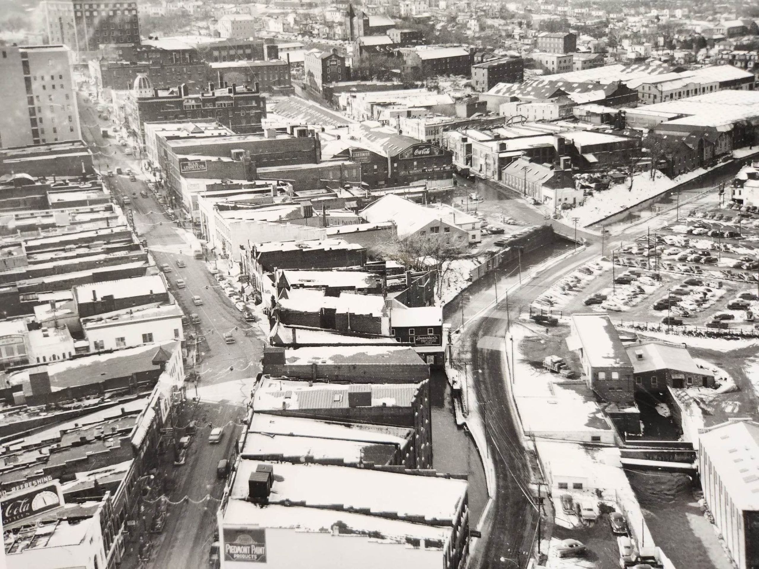 A black and white photo of downtown Danville before the 1970s, with the canal running through the right side of the frame.
