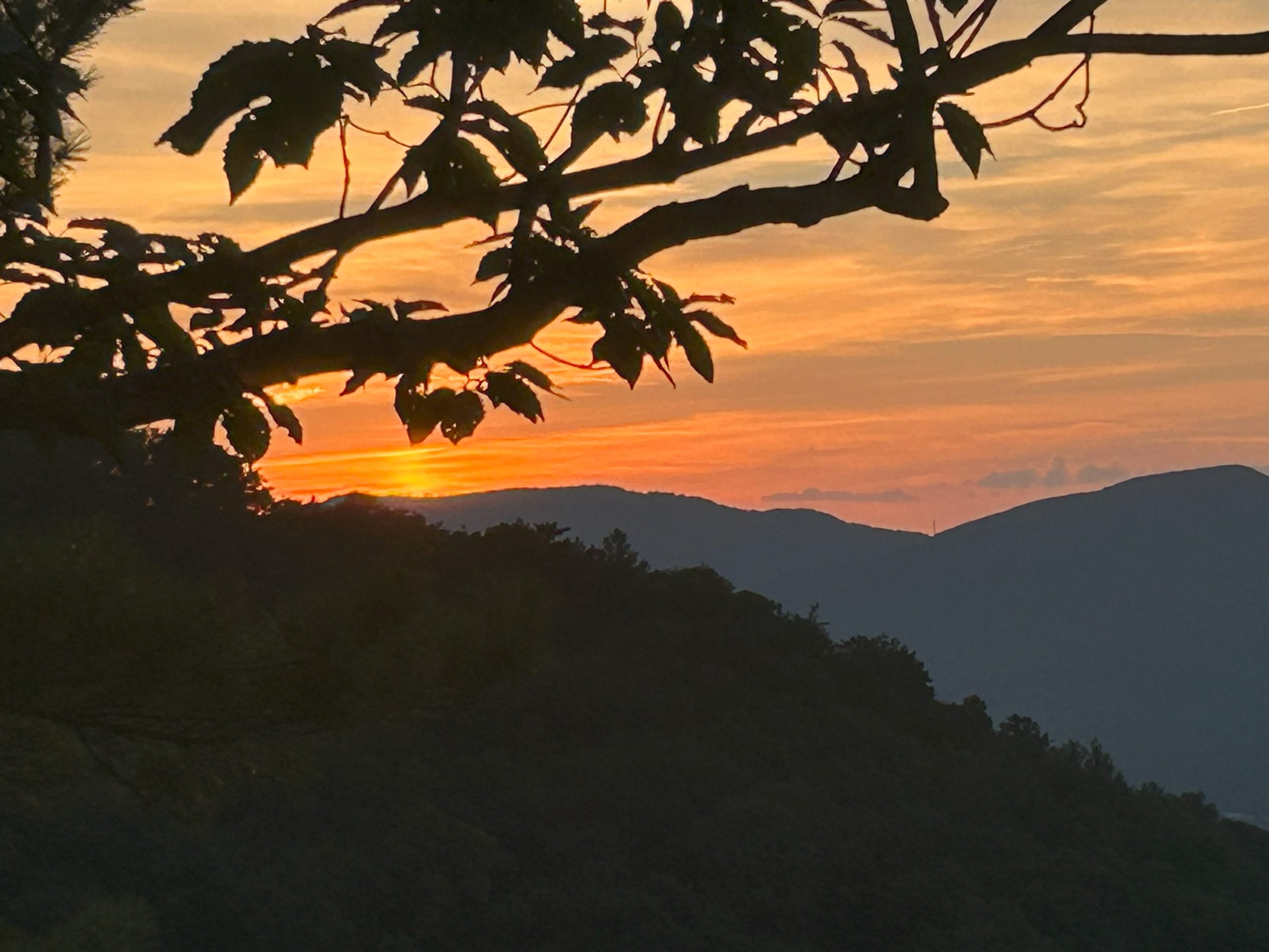A red sunset caps a hot Friday, July 25, at Poor Mountain Natural Area Preserve in southwest Roanoke County. Cooler weather is expected to move in this weekend. Photo by Kevin Myatt.