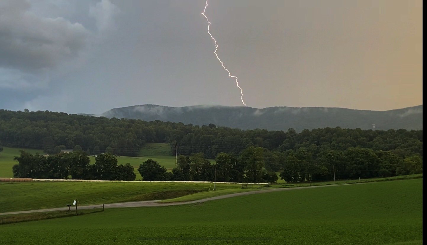 Lightning crashes behind a mountain ridge in Botetourt County on Saturday, June 28.