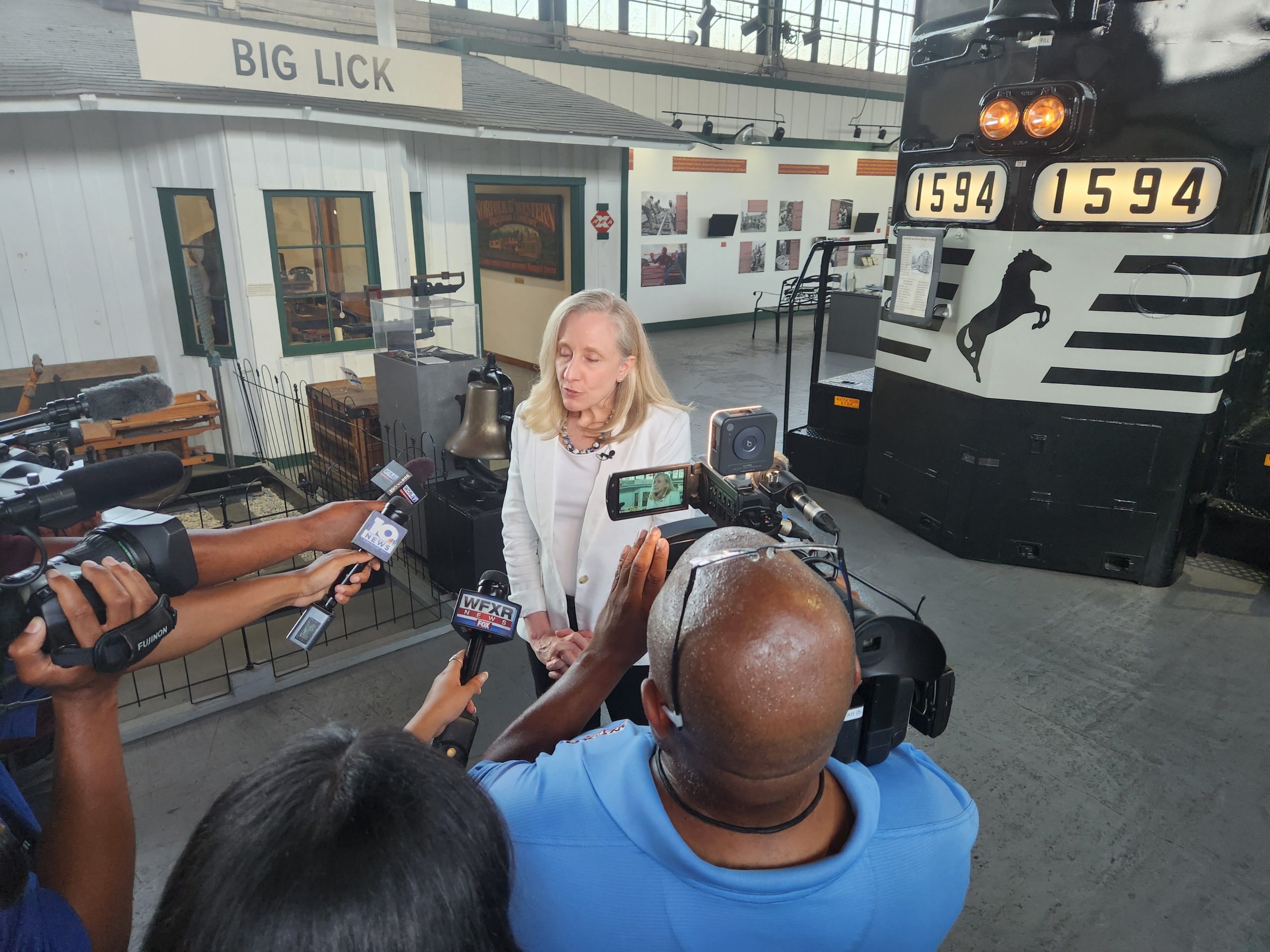 Abigail Spanberger meets with reporters at the Virginia Museum of Transportation during a stop in Roanoke. Photo by Dwayne Yancey.