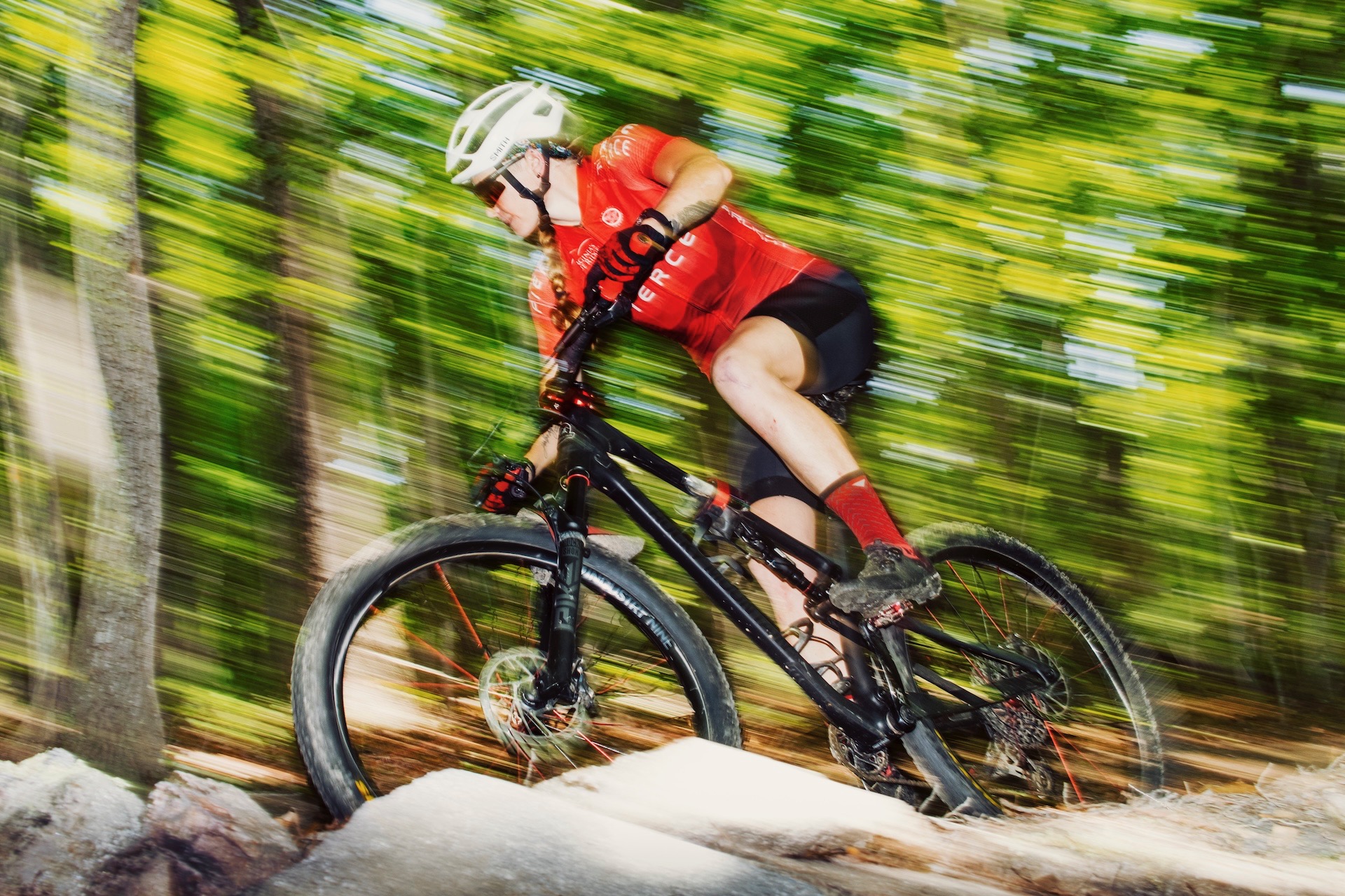 a woman on a mountain bike
