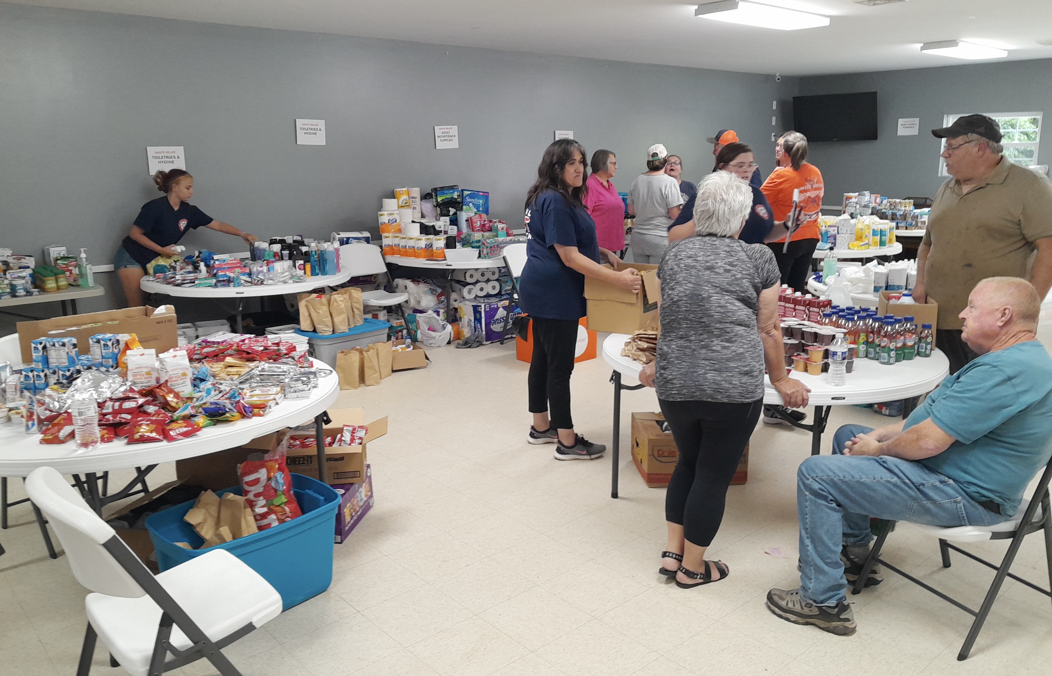 Volunteers stand ready to offer supplies in the recovery center. Photo by Jeff Lester.