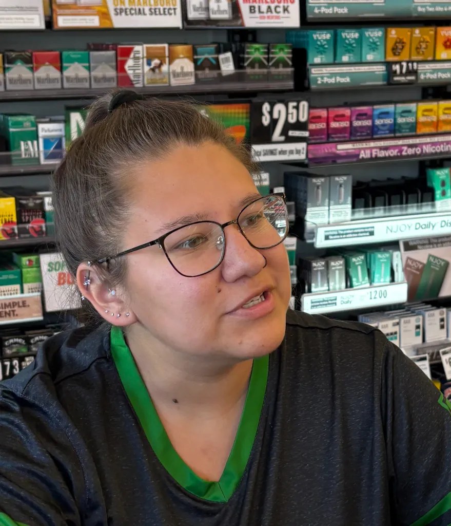 Mug shot of Vanessa Mutherspaw, in front of a 7-Eleven cigarette display case in Mount Crawford.