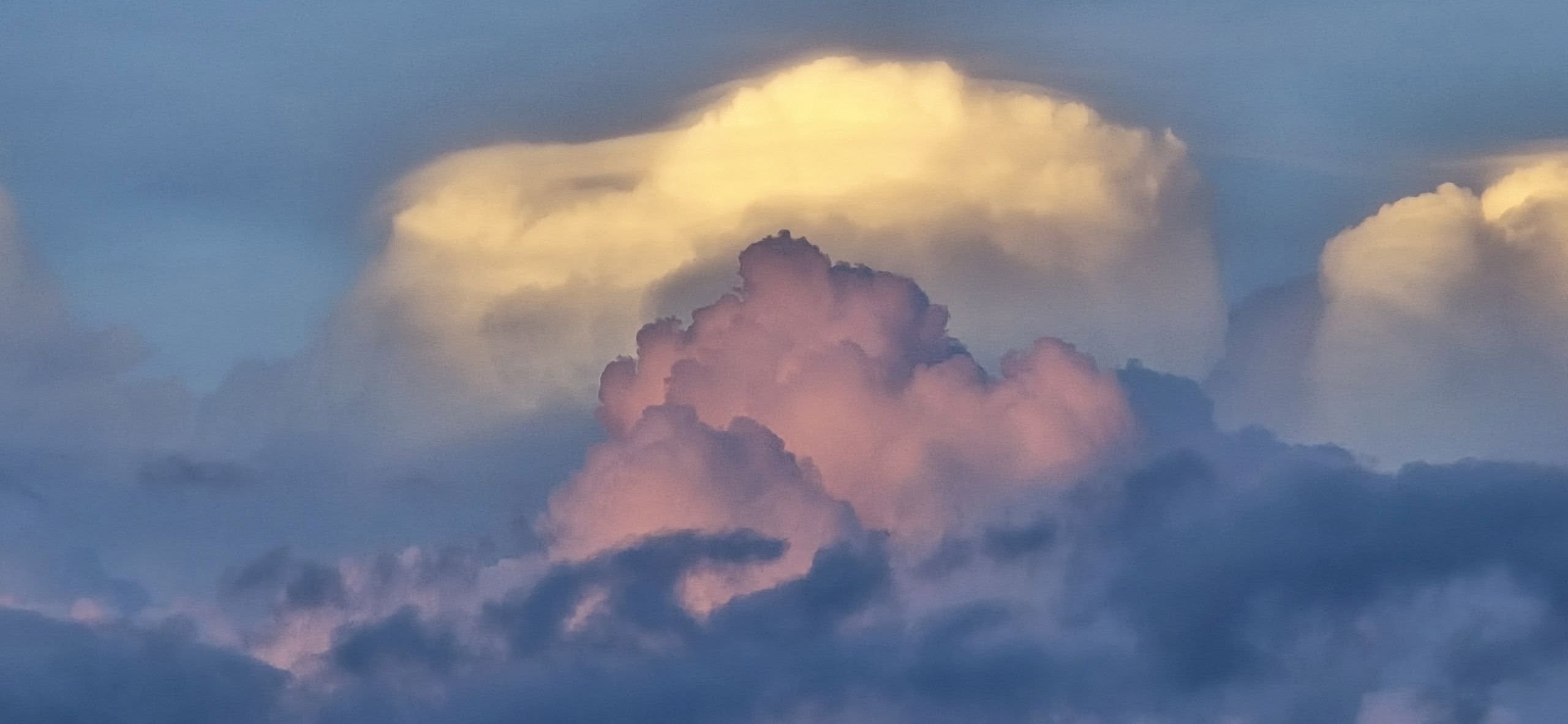 Late-day cumulus clouds billow with a backdrop of more mature and distant cumulonimbus clouds, as seen from the Cave Spring area of Roanoke County on Wednesday evening, Aug. 13. Courtesy of Julia Carter.