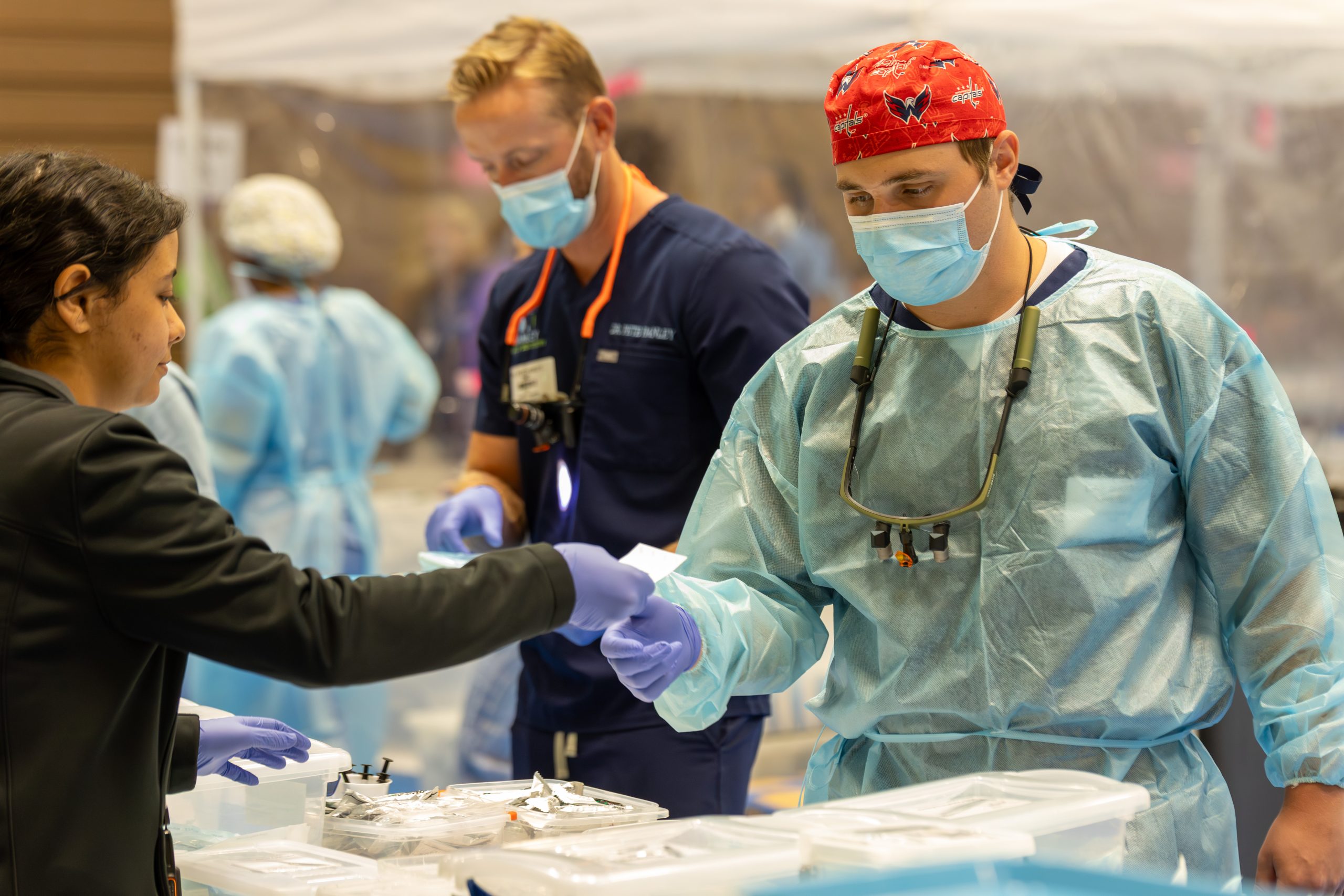 Medical professional wear blue personal protective equipment at a Remote Area Medical pop-up clinic in Emporia, Virginia in 2024. Courtesy of Allison McCauley-Cook, media relations manager for RAM.