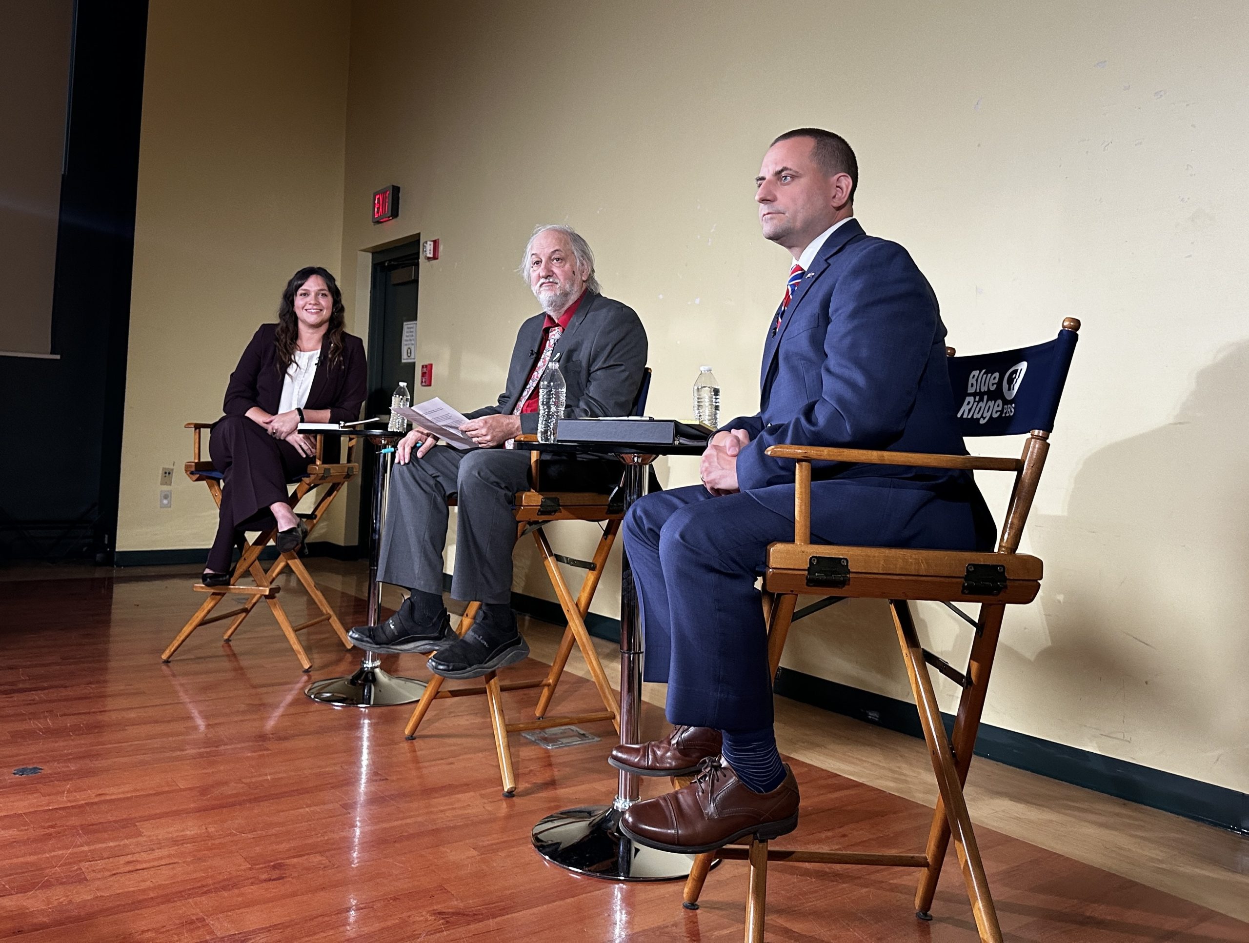 Lily Franklin (left) and Del. Chris Obenshain (right) spoke with moderator Dwayne Yancey at a candidate forum in Blacksburg in 2023. Cardinal News file photo.
