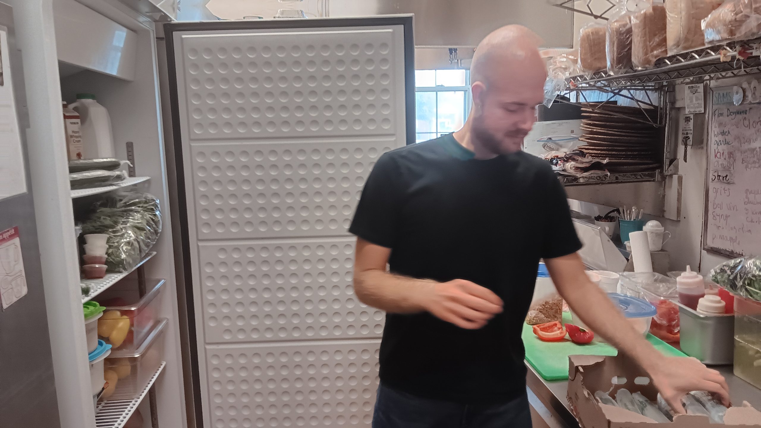 Al Herndon prepares for the lunchtime rush, Tuesday.