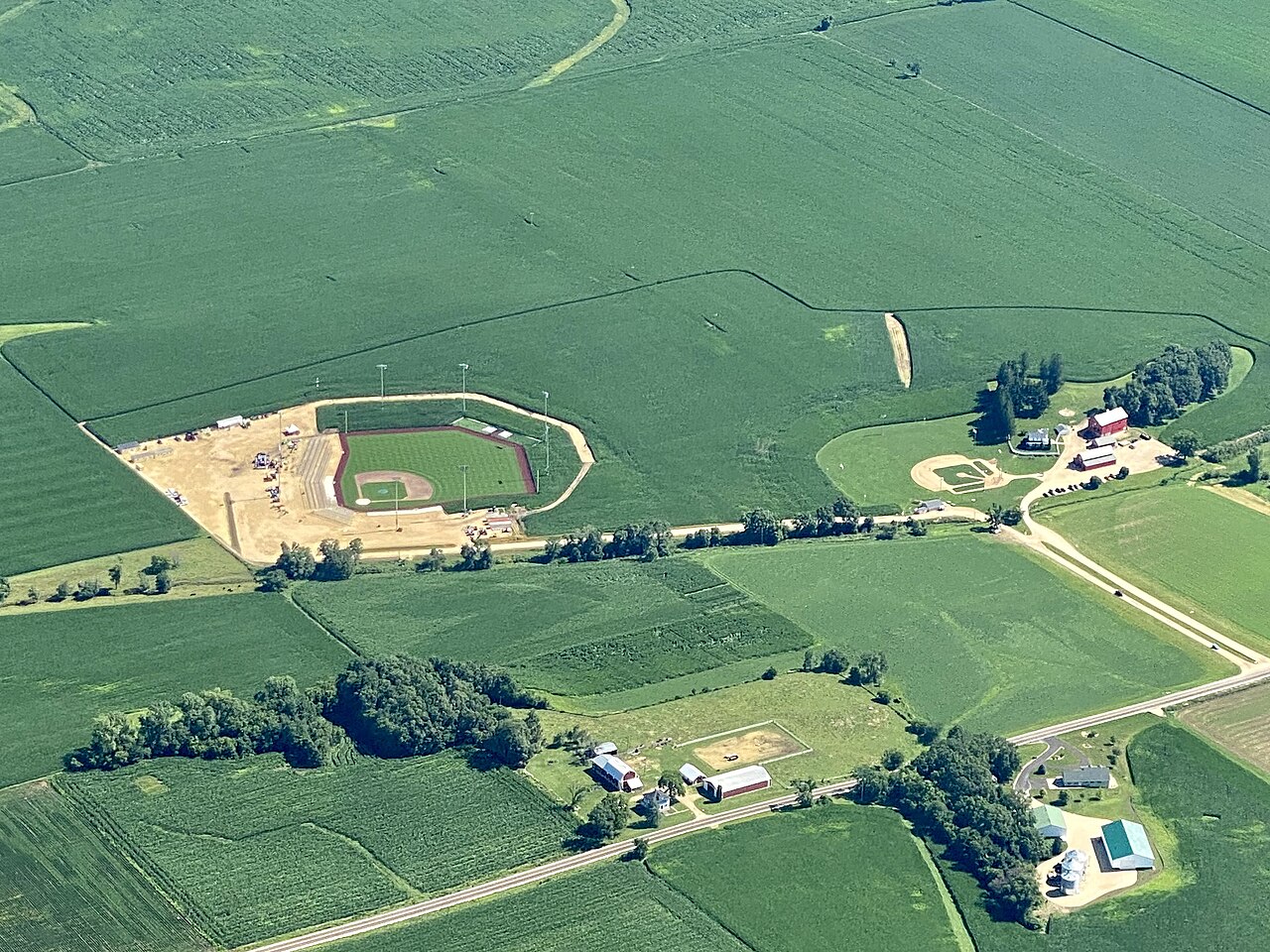 Aerial view of ballparks near Dyersville, Iowa. The baseball field on the right side of the image is the location where the movie Field of Dreams was filmed. The ballpark on the left side of the image was constructed by Major League Baseball (MLB) to host the "MLB at Field of Dreams" game. Courtesy of Michael Miley. 