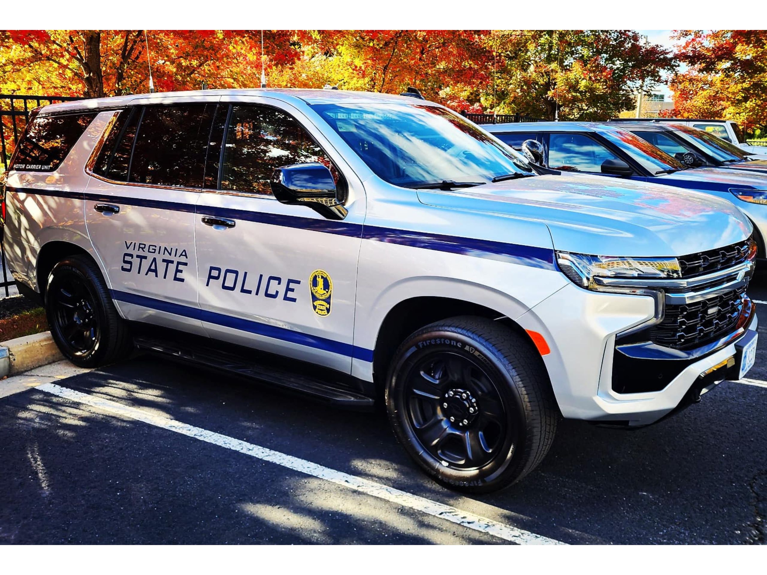 A Chevy Tahoe Virginia State Police vehicle in a parking lot.