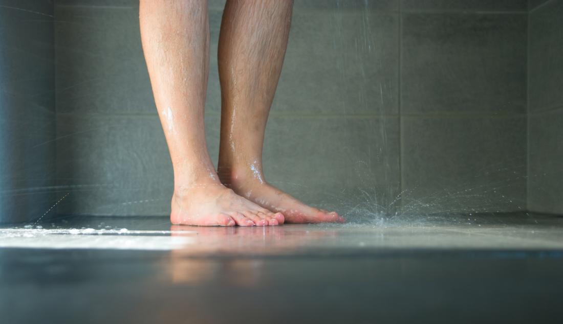 man standing in the shower