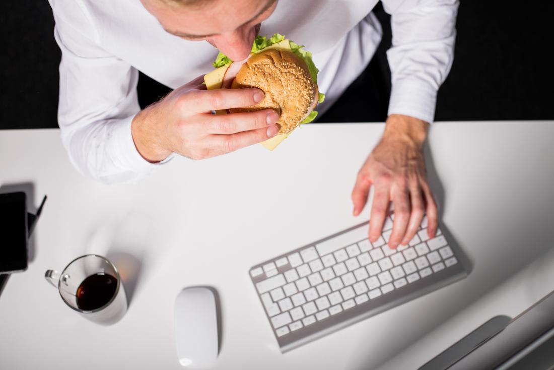 Businessman at his desk emotional eating