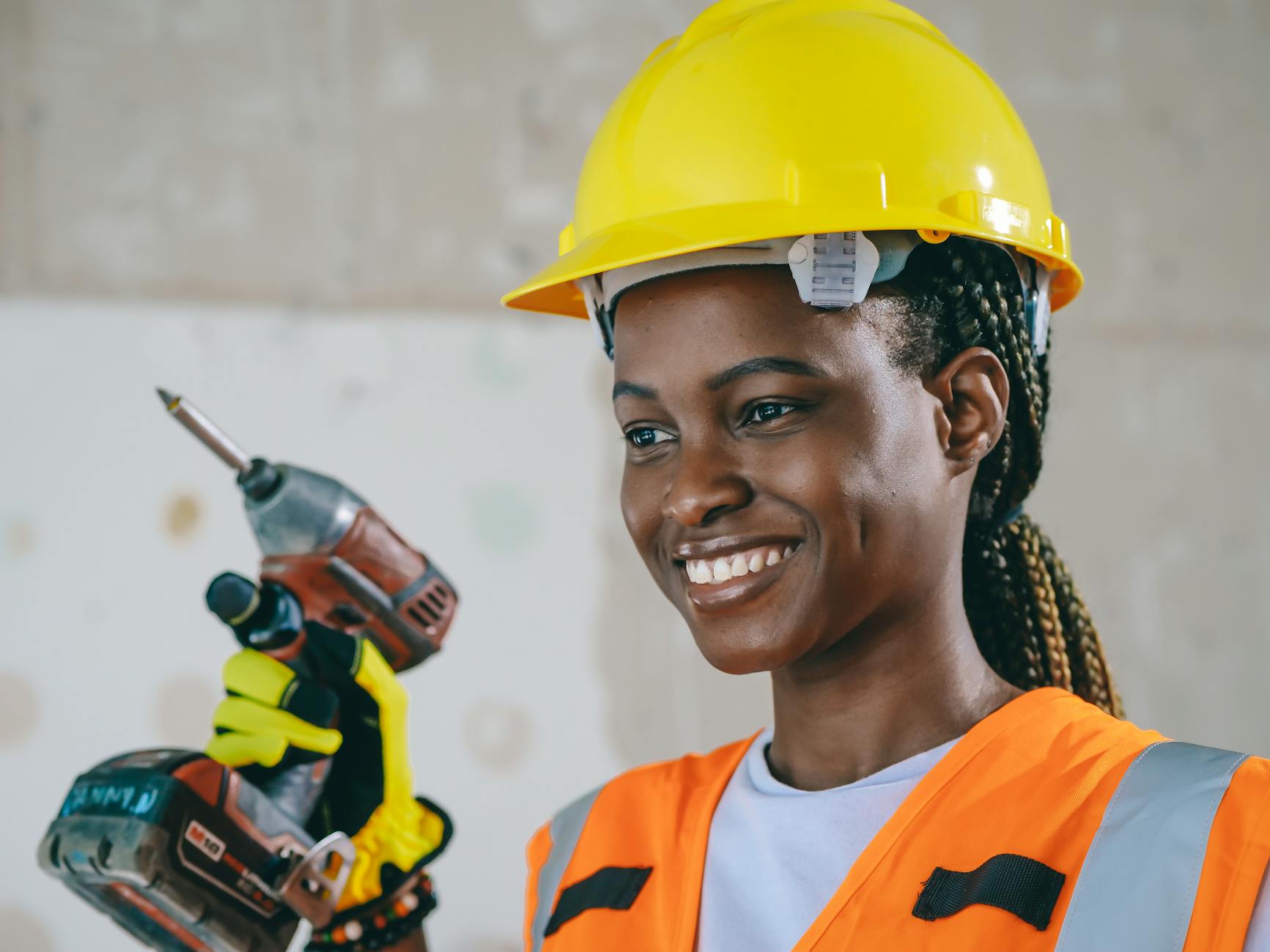 smiling woman holding a hand grill