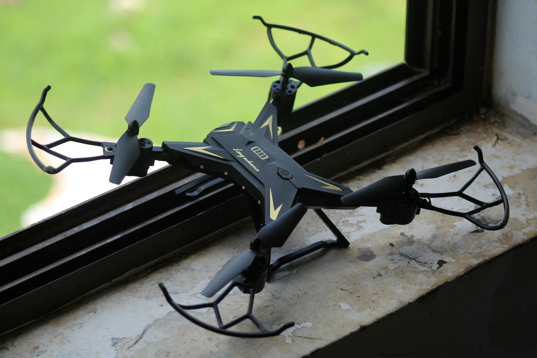 drone on window sill with outdoor view
