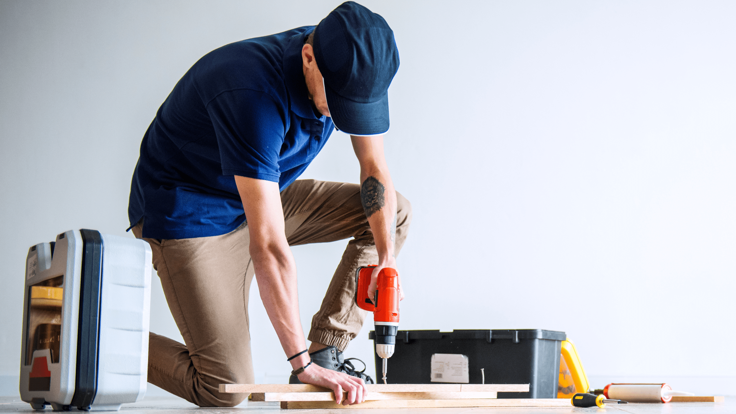 A man installing exhaust fan with light