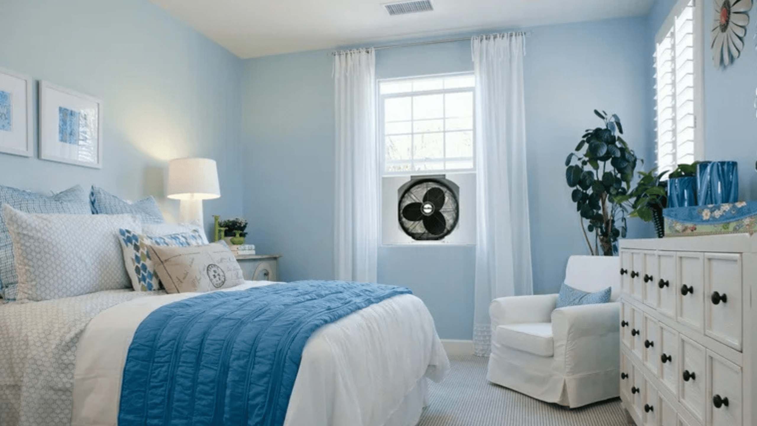 A bedroom with window exhaust fan