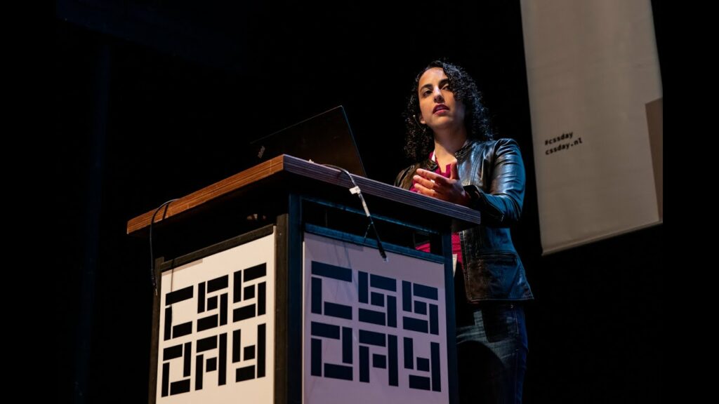 Elike Etemad speaking in front of a podium for CSS Day.