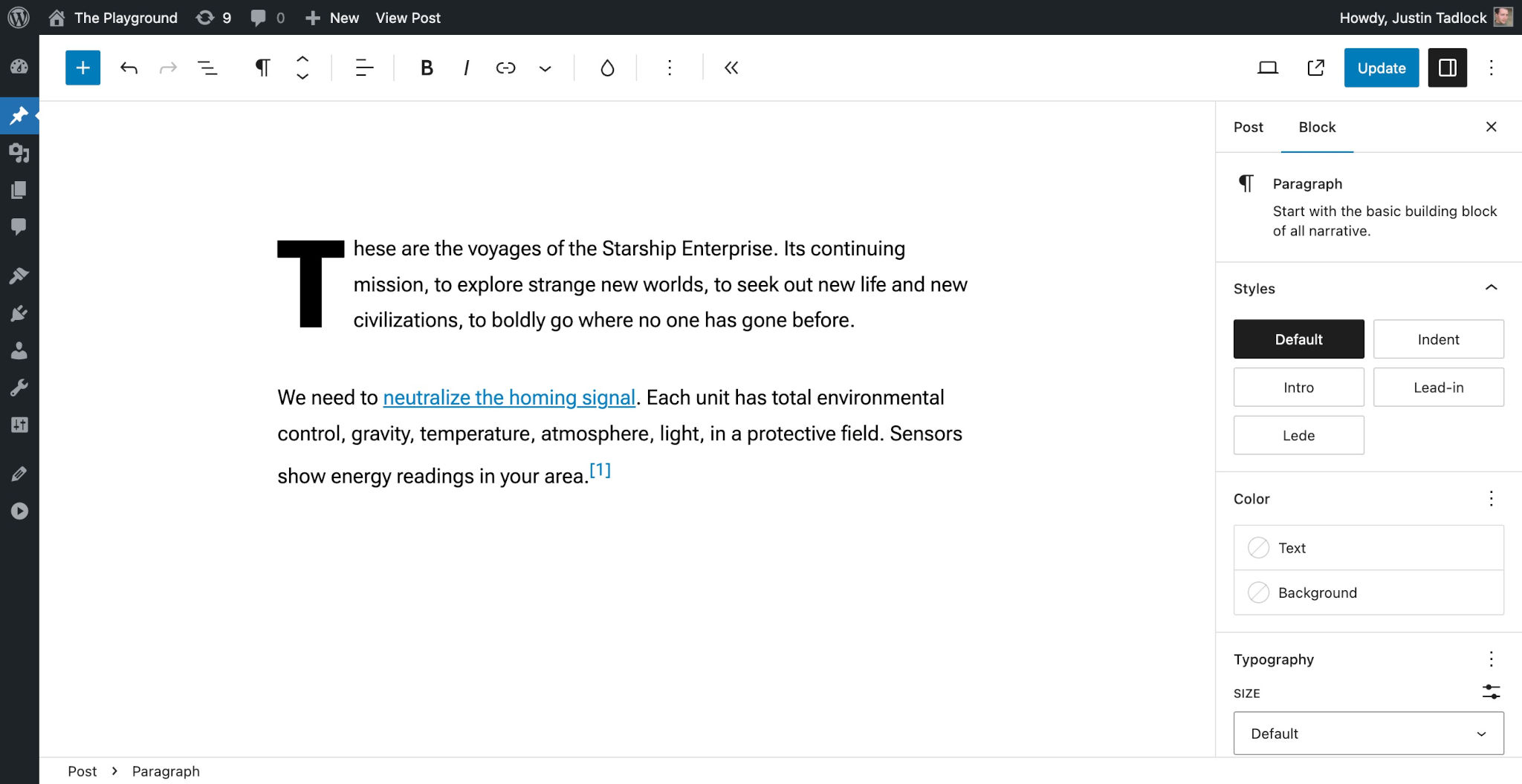 WordPress post editor with a couple of demo paragraphs. The image reflects the black text color and blue link color.