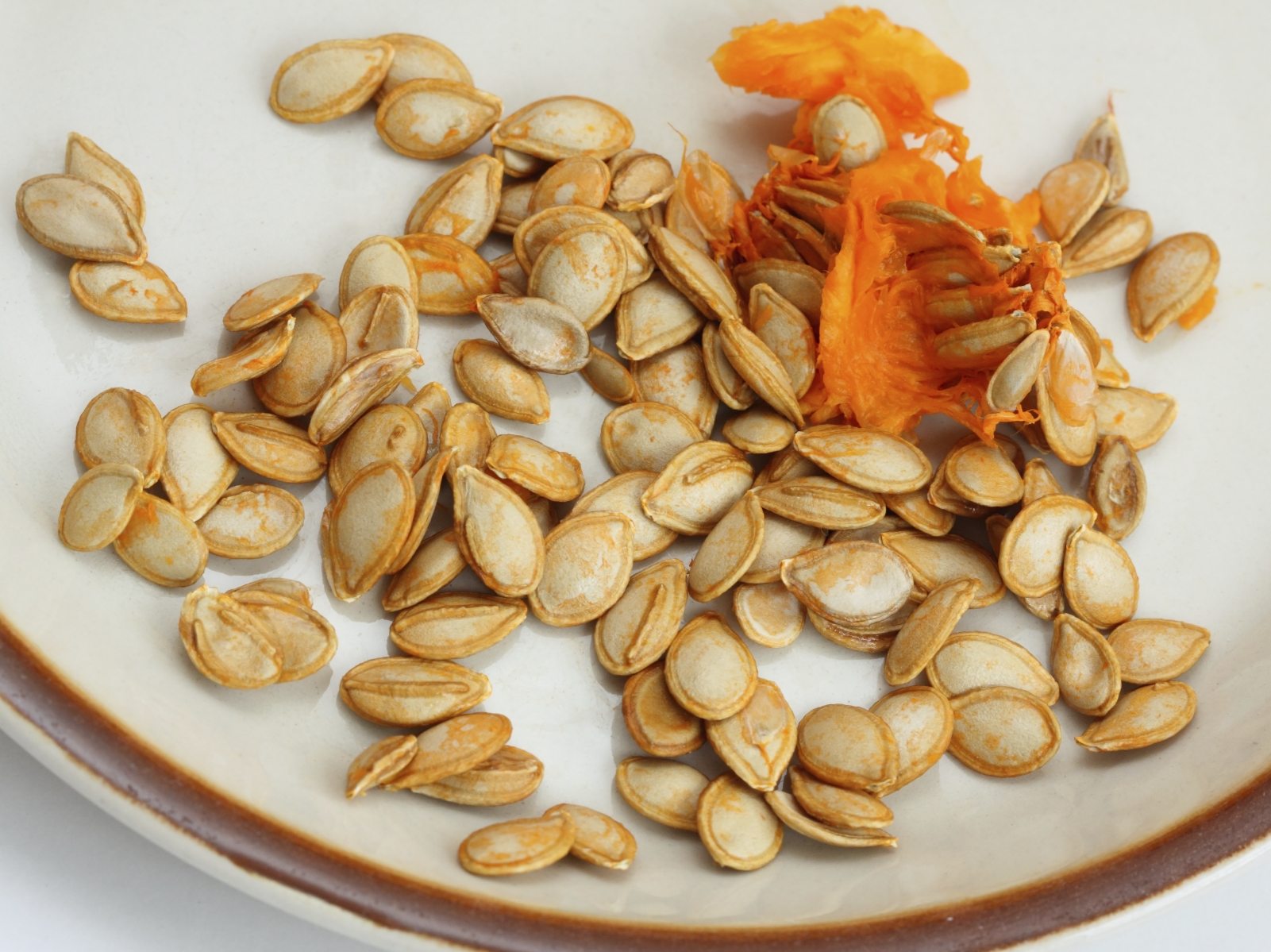 How do you remove the outer shell from pumpkin seeds