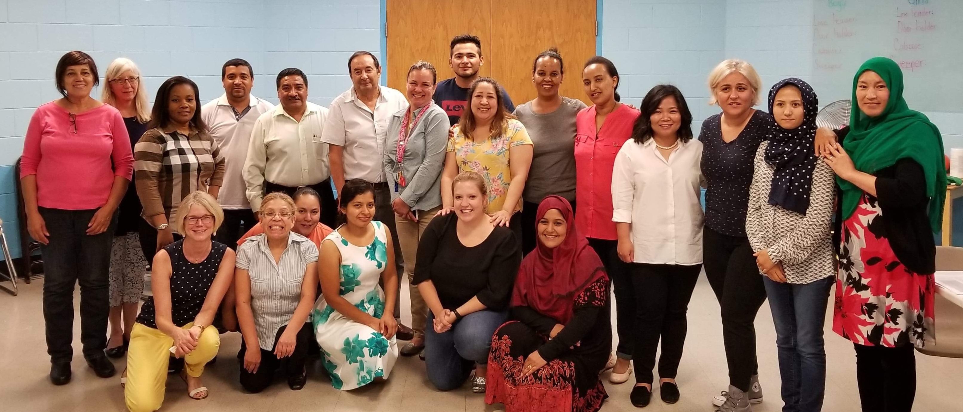 Class photo of English language learners enrolled in English Empowerment Center programs