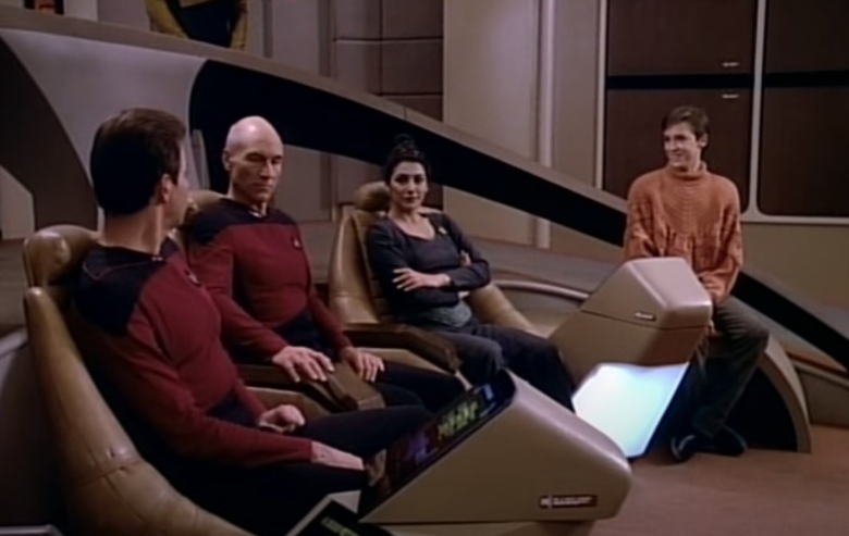 Jonathan Frakes as William Riker, Patrick Stewart as Jean-Luc Picard, Marina Sirtis as Deanna Troi, and Wil Wheaton as Wesley Crusher on the bridge of the Enterprise on Star Trek the Next Generation