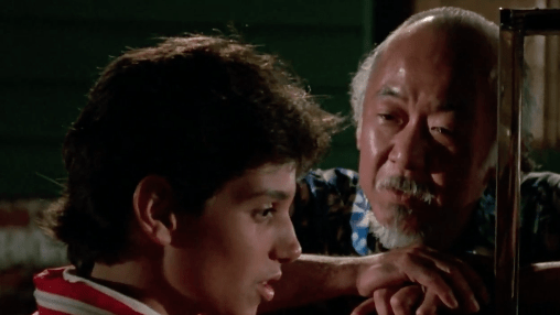 Mr. Miyagi (Pat Morita) gifts Daniel LaRusso (Ralph Macchio) a car for his birthday.