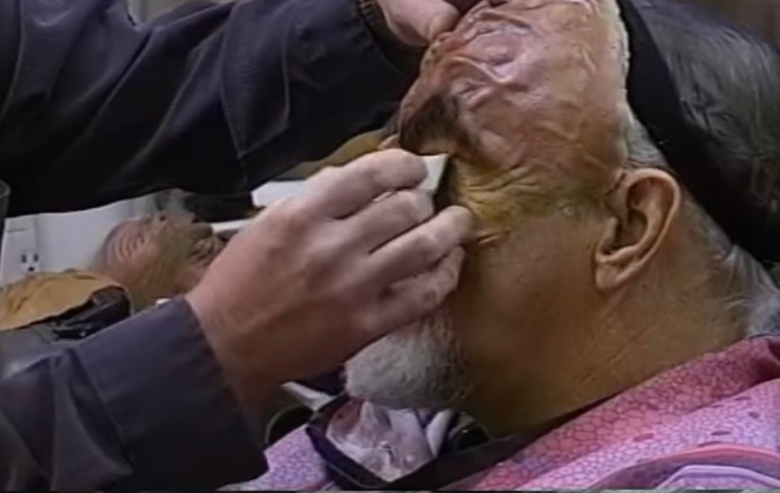 Makeup artist applying Klingon makeup for "Star Trek"