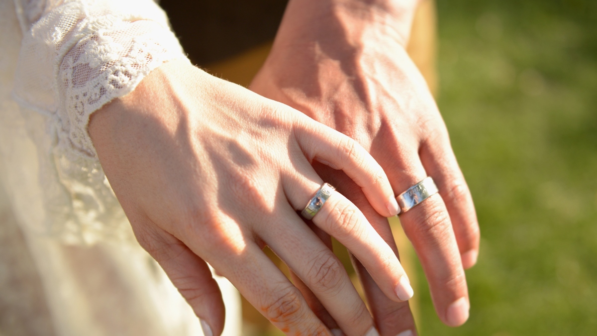Bride and groom wedding rings