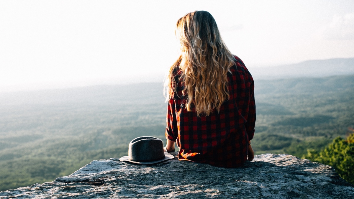 Blond woman on cliff