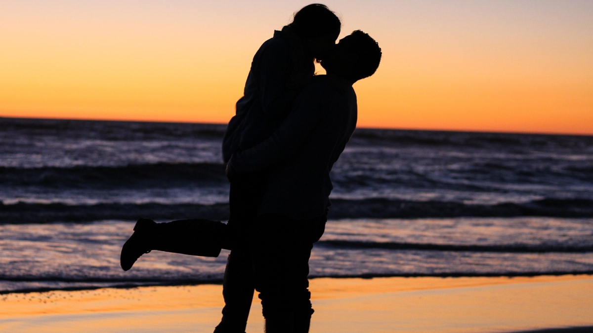Couple kissing on beach