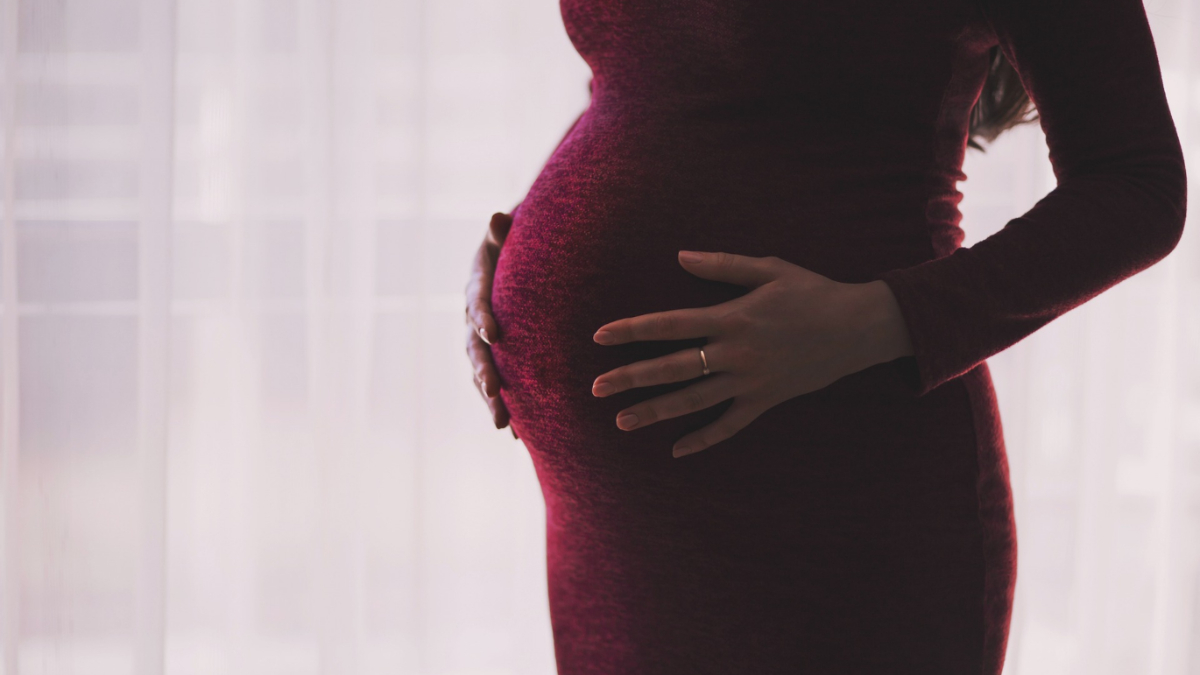 A pregnant woman.