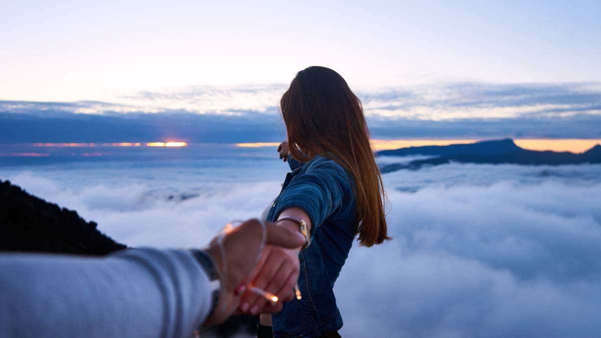 A man and woman holding hands.