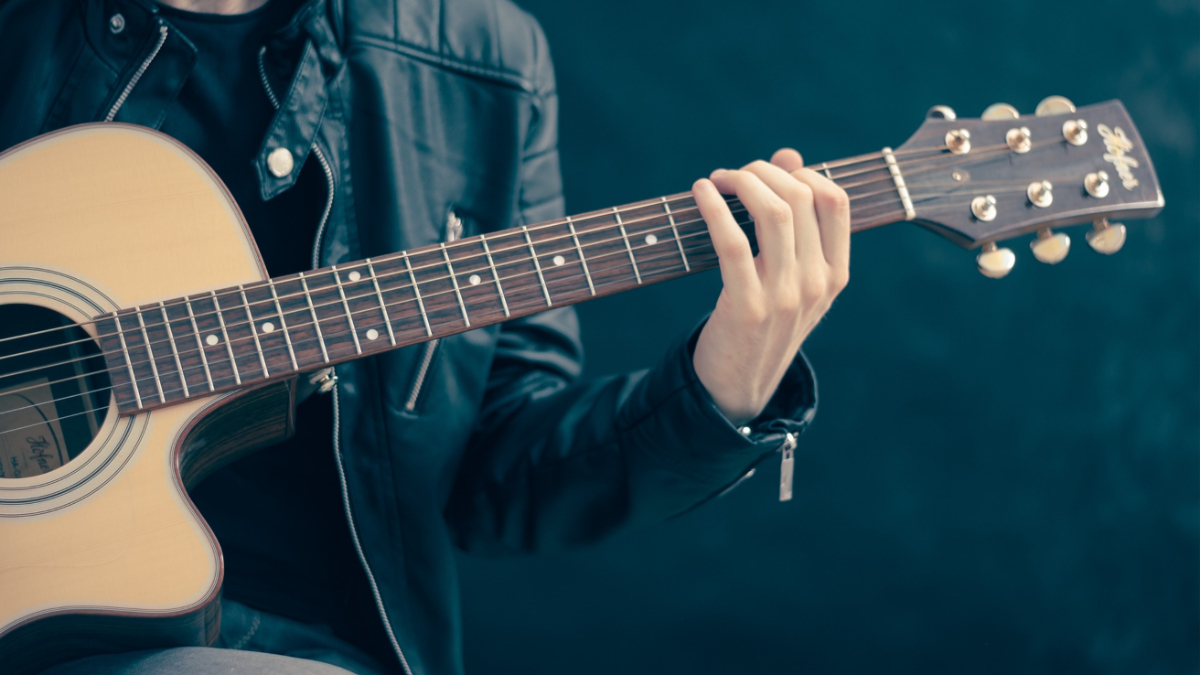 A man playing a guitar.