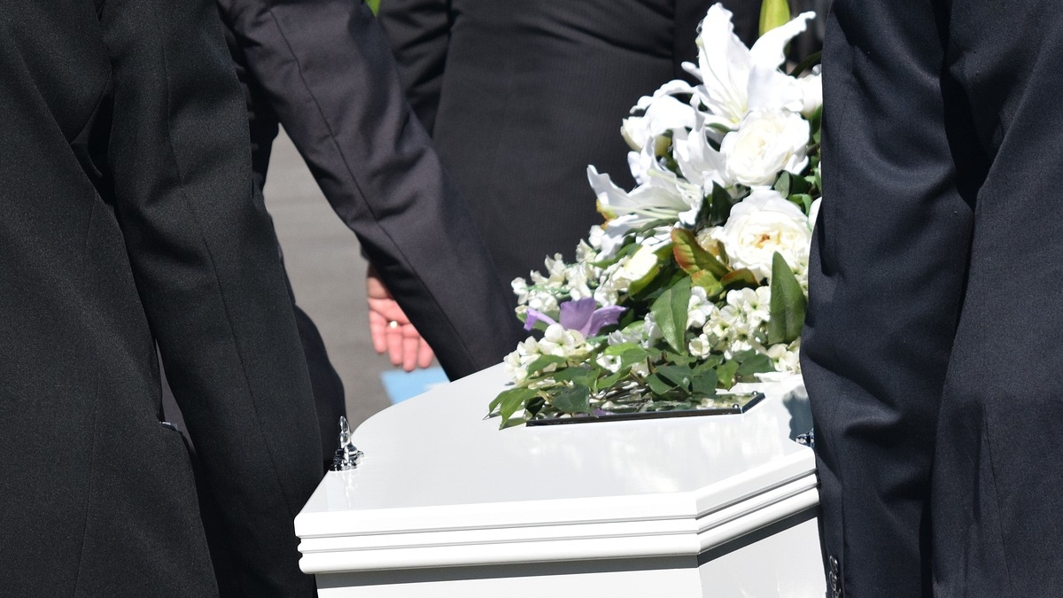 Pallbears and casket