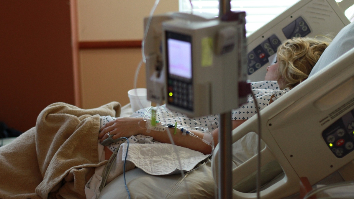 Woman in hospital bed