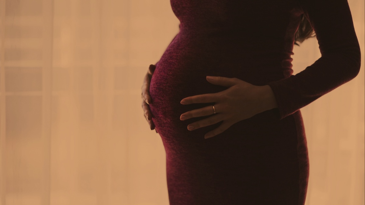 A pregnant woman.