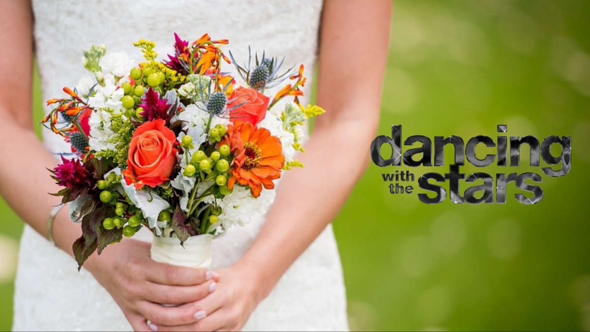A bride holding flowers.