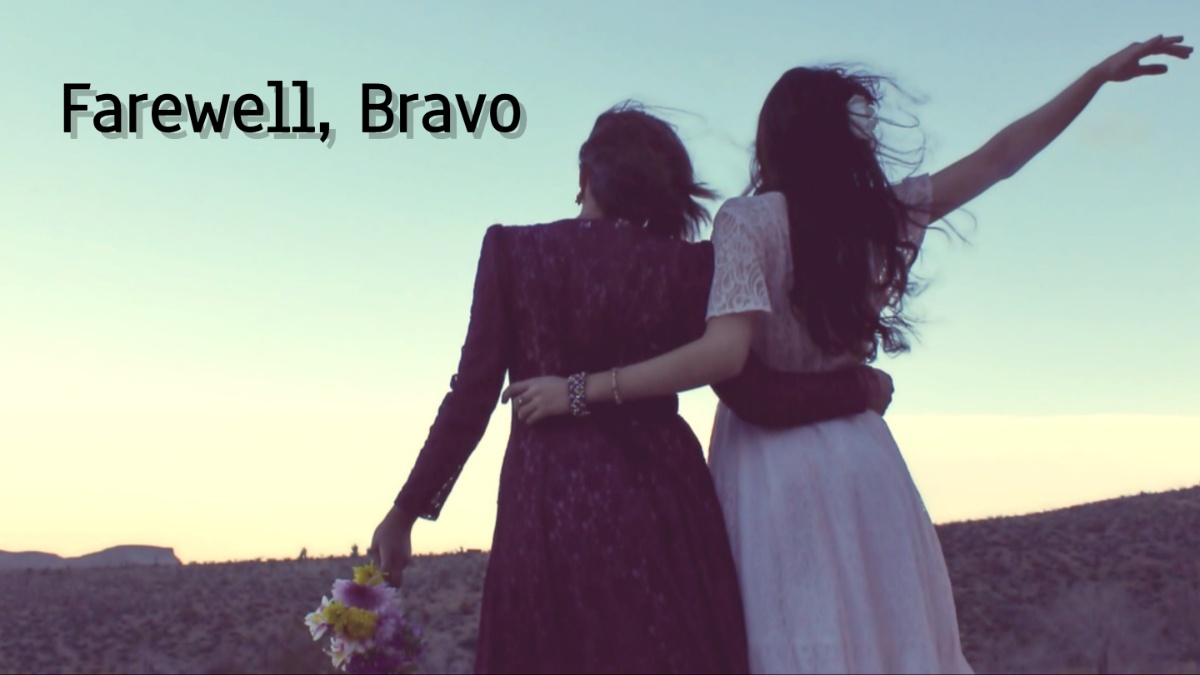 Two women waving goodbye.