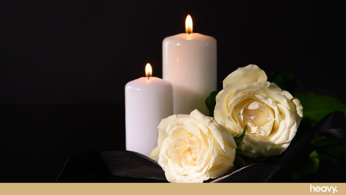 A picture of candles and roses. Stars are comforting each other after Doherty's death.