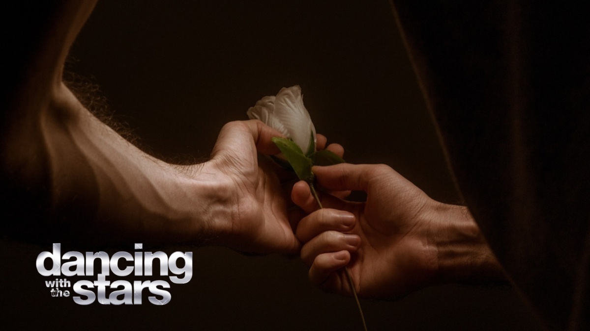 A man holding a rose.
