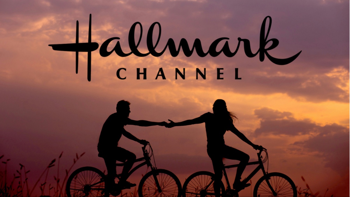 Two people riding bikes.