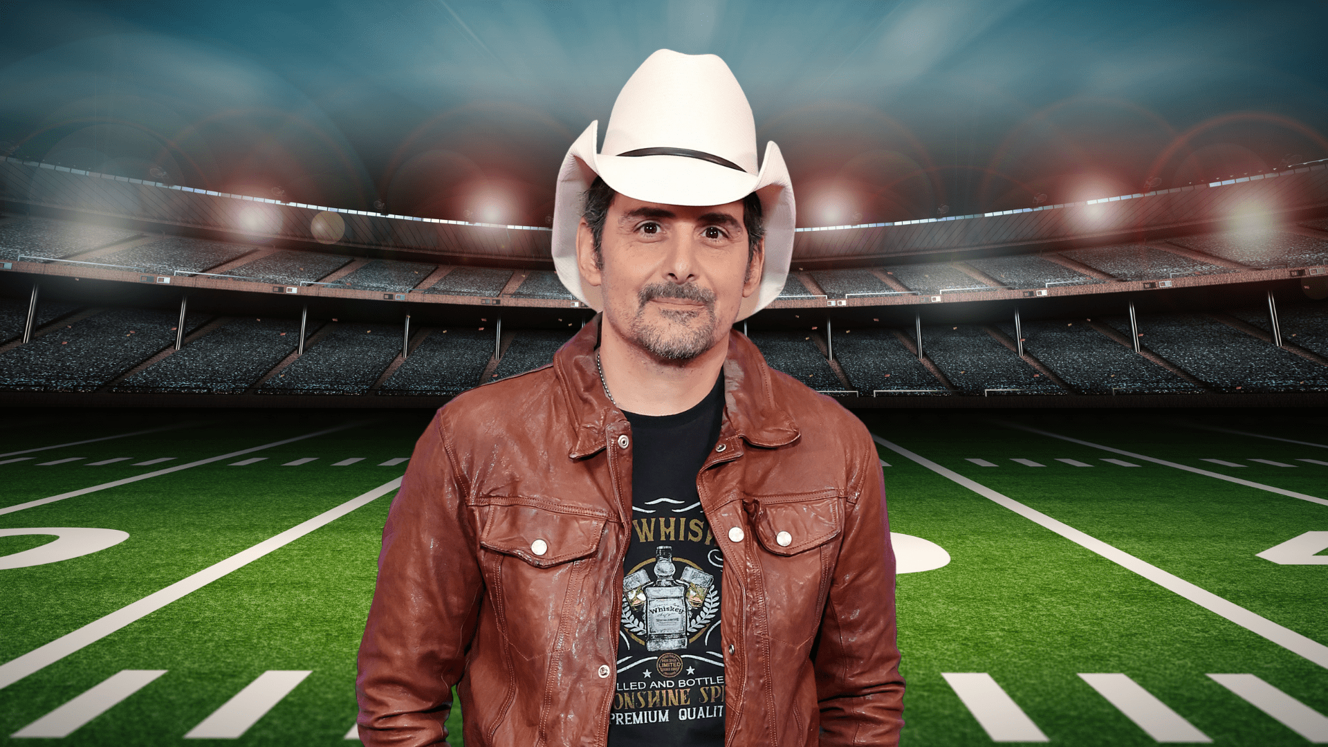 Brad Paisley posing on a football field