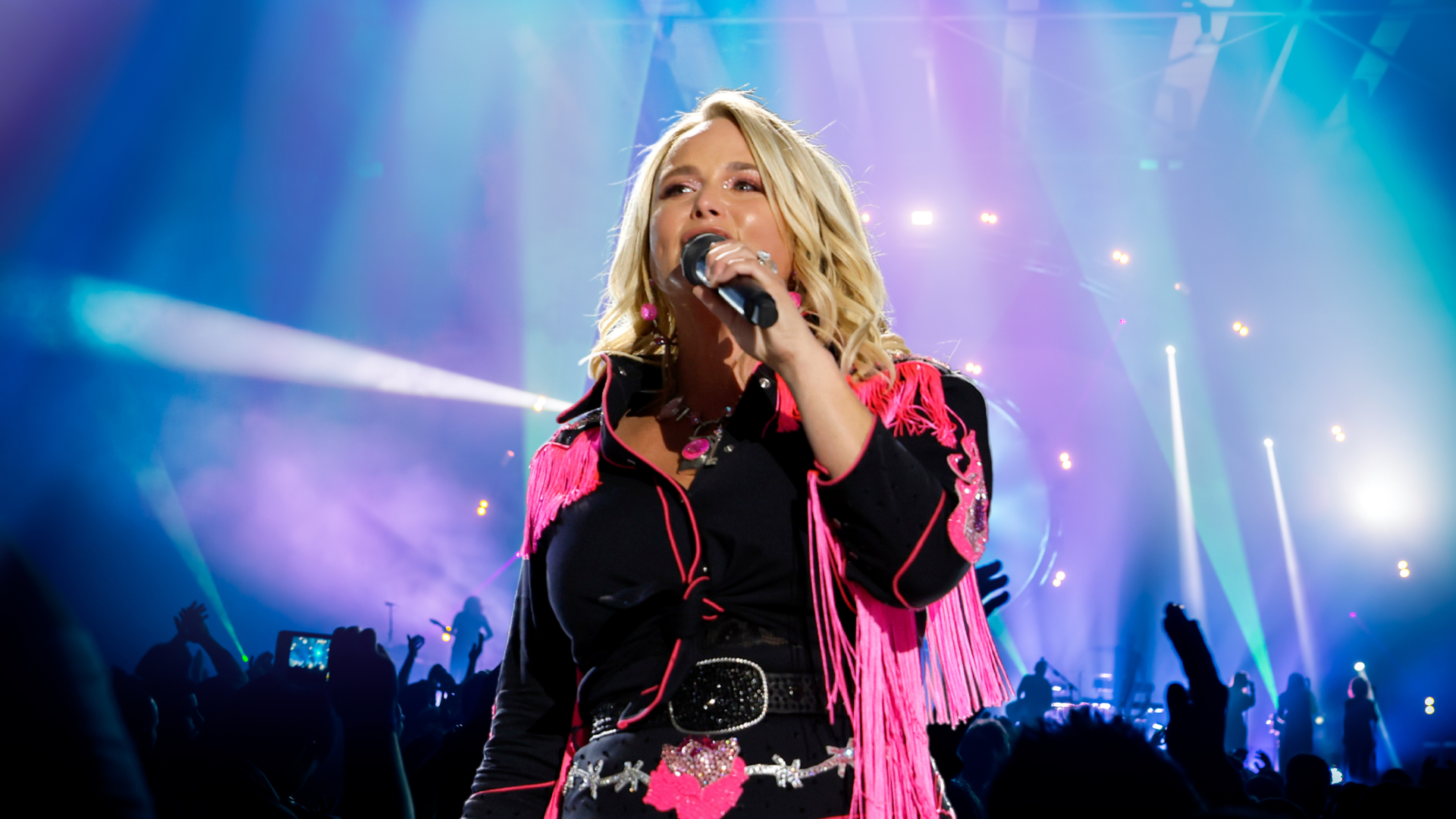 Miranda Lambert sings into a microphone